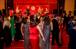 Crowded dance floor lit in red